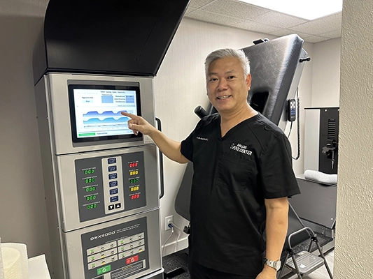 Chiropractor Carrollton TX Hoa Nguyen With DRX9000 Machine