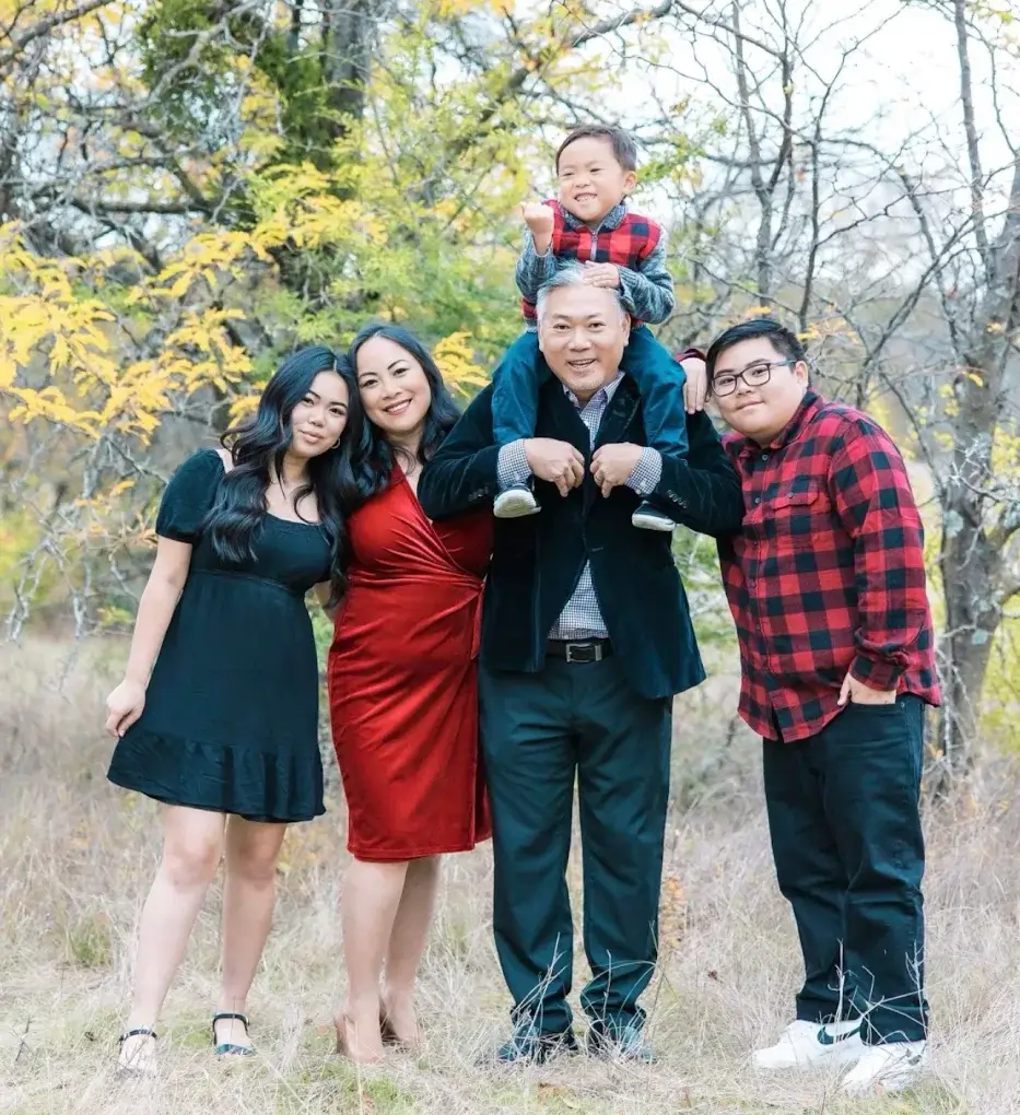 Dr. Hoa Nguyen with his wife and three children outdoors