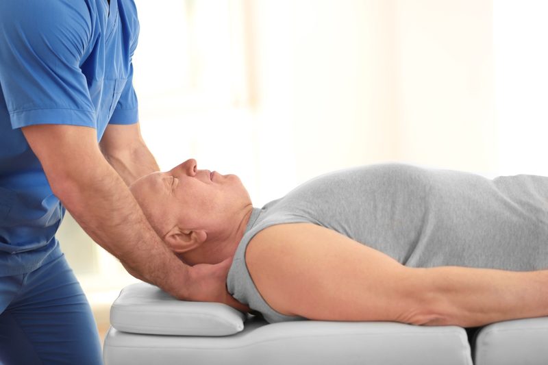 Dr. Hoa Nguyen provides chiropractic adjustments at Dallas Spine Center in Carrollton, TX