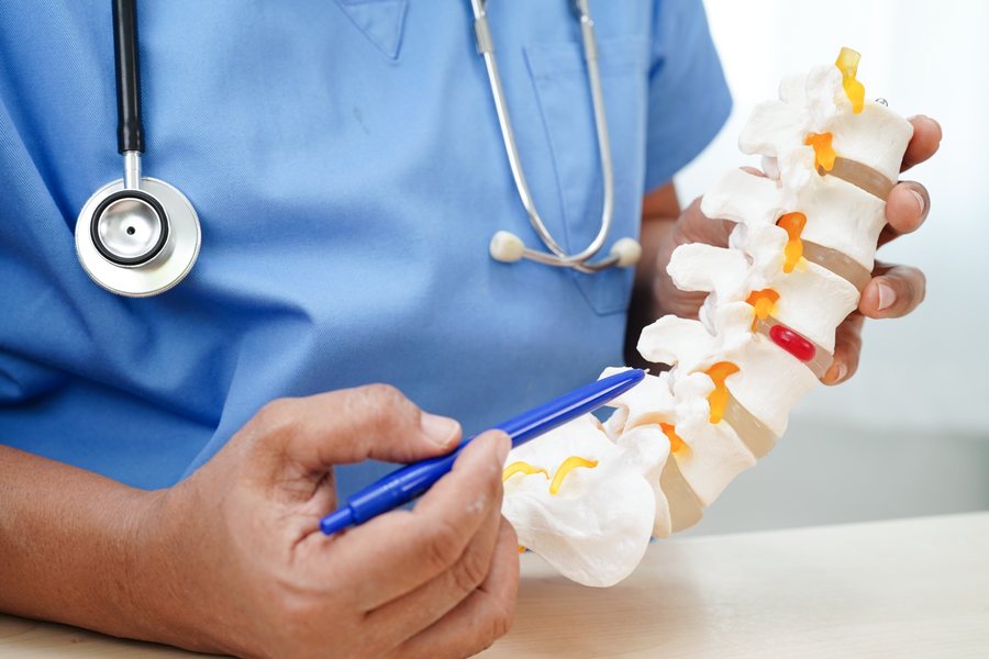 Chiropractor in Carrollton TX explaining a herniated disc to a patient