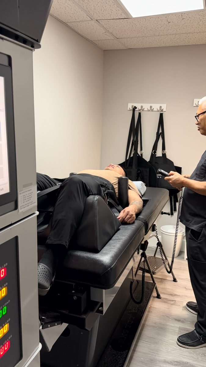 Patient positioned on the DRX9000 spinal decompression table in Carrollton, TX